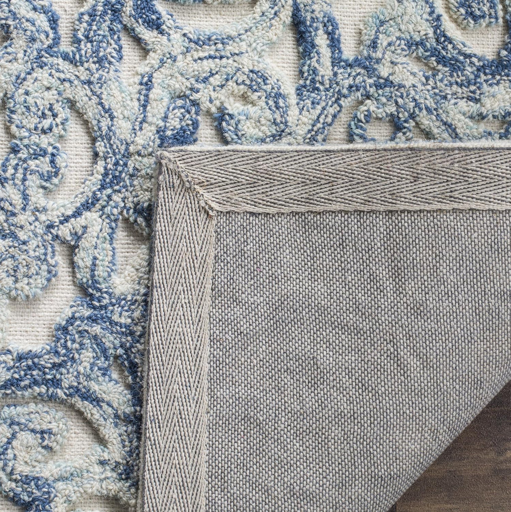 SAFAVIEH Trace Collection Area Rug - 9' x 12', Blue & Ivory, Handmade Wool, Ideal for High Traffic Areas in Living Room, Bedroom (TRC103B)