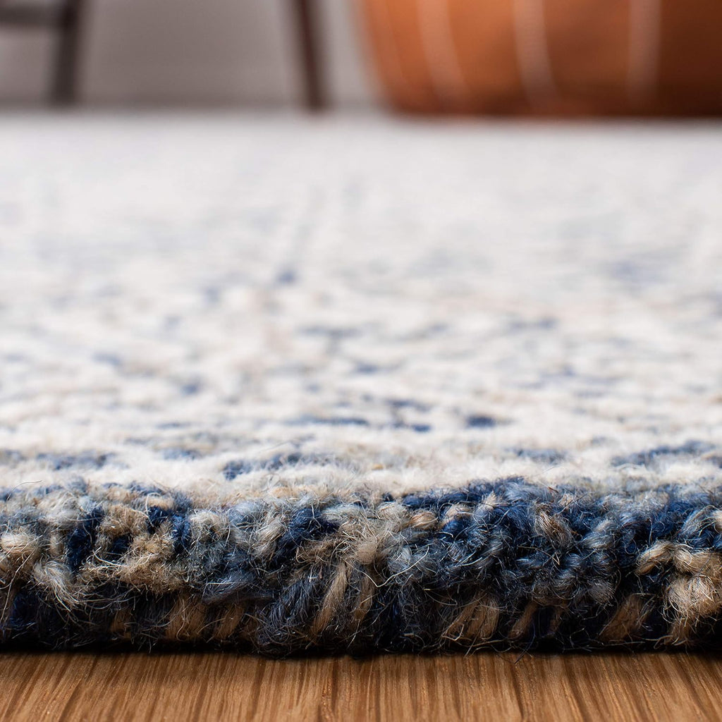 SAFAVIEH Micro-Loop Collection Area Rug - 9' x 12', Navy & Ivory, Handmade Wool, Ideal for High Traffic Areas in Living Room, Bedroom (MLP526N)