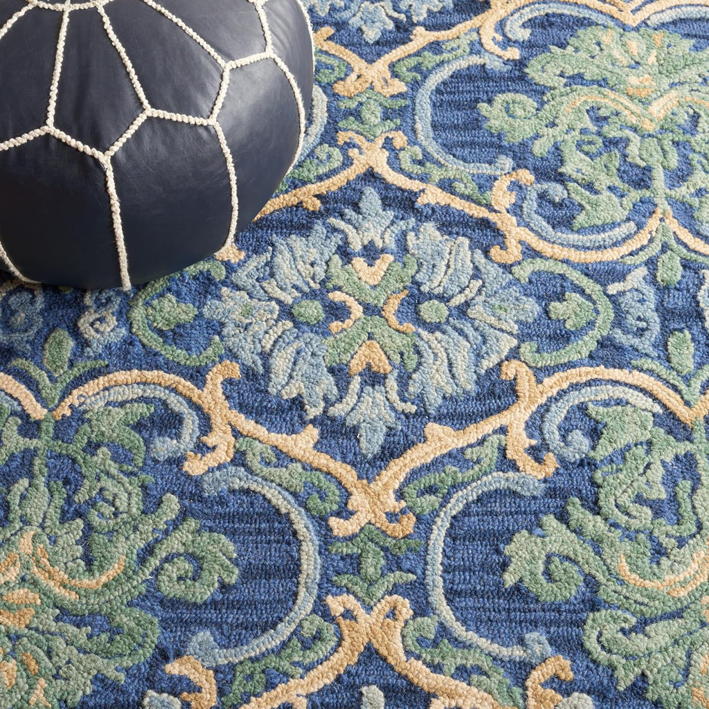 SAFAVIEH Blossom Collection Area Rug - 9' x 12', Navy & Green, Handmade Boho Fringe Wool, Ideal for High Traffic Areas in Living Room, Bedroom (BLM422A)