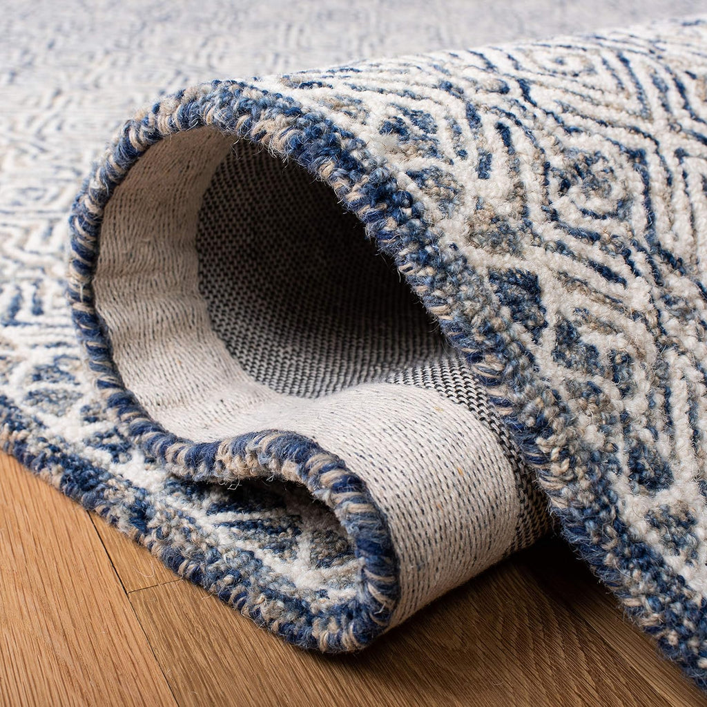 SAFAVIEH Micro-Loop Collection Area Rug - 9' x 12', Navy & Ivory, Handmade Wool, Ideal for High Traffic Areas in Living Room, Bedroom (MLP526N)